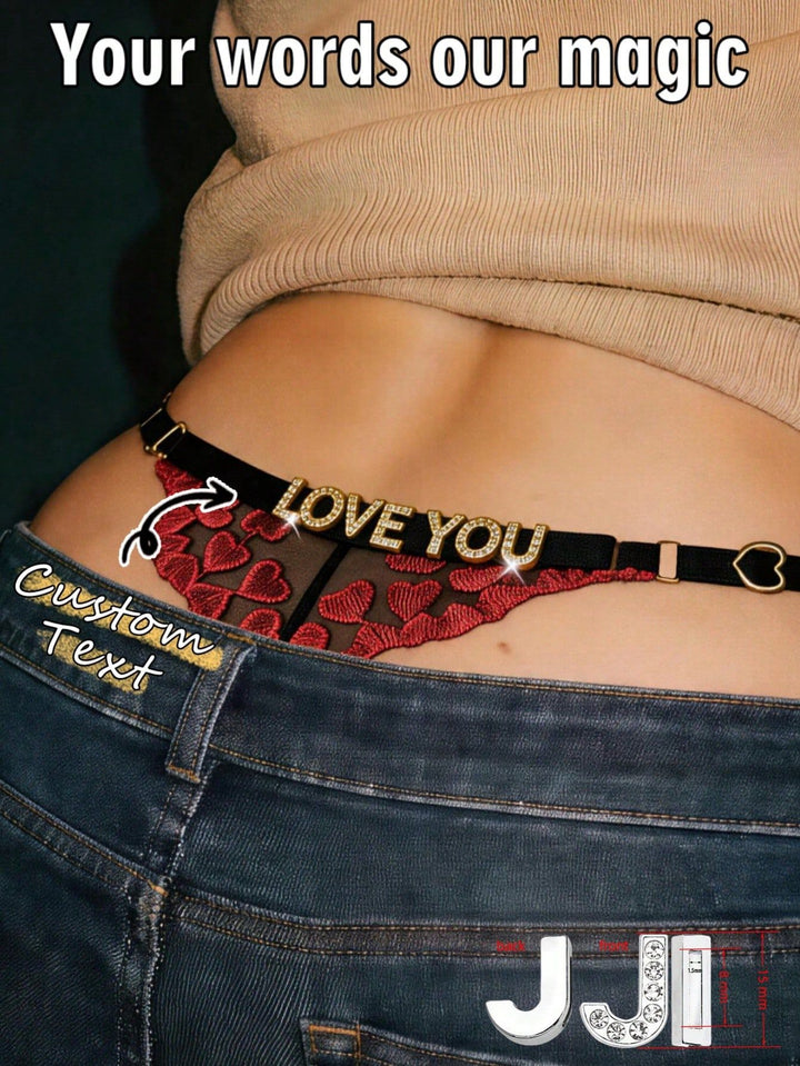 Model wearing personalized rhinestone name thong styled with low-rise jeans showing custom "LOVE YOU" text